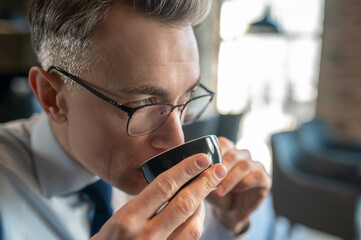 Businessman having morning coffee in a cafe