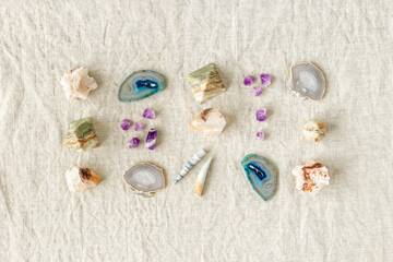 Pattern of healing crystals. Gemstones rocks for magic crystal ritual, chakra relaxation, reiki healing therapy, aura readings. Top view magic minerals or stones on cloth background, flat lay