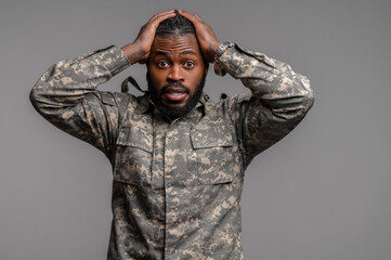 Surprised military man staring at something before him