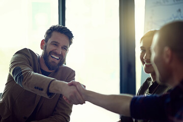 It makes me happy knowing youre part of the team. Cropped shot of two businessmen shaking hands.