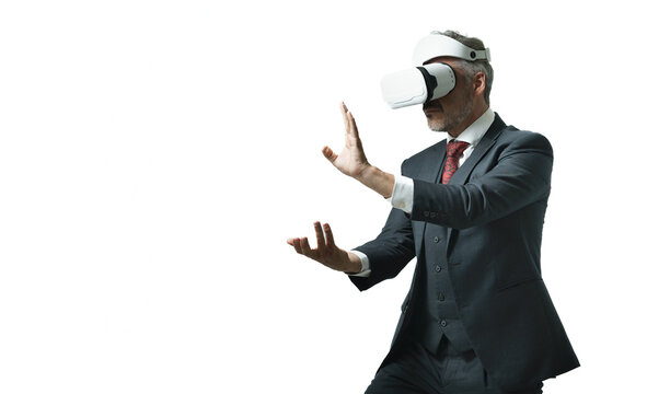 Businessman wearing VR goggles using metaverse technology innovation to learn taichi from virtual online, Digital business with martial art concept. AR or Augmented reality technology futuristic.