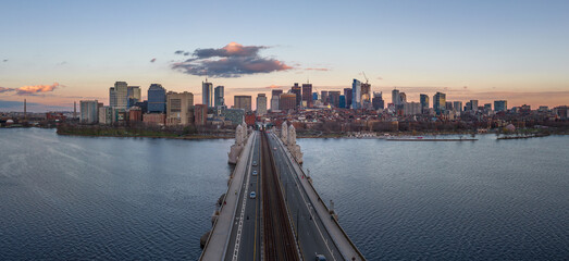 Sunset over Boston downtown with sky scrapers with views of the Longfellow bridge over the Charles...