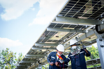 The solar farm(solar panel) with engineers use multimeter check the operation of the system, Alternative energy to conserve the world's energy, Photovoltaic module idea for clean energy production