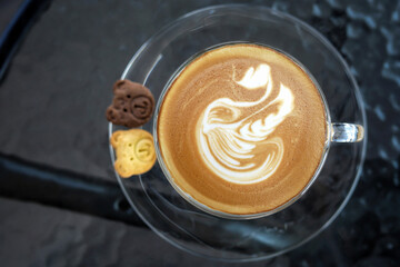 Cappuccino coffee in a beautiful mug Put on your favorite cup of coffee idea in the morning on vacation.