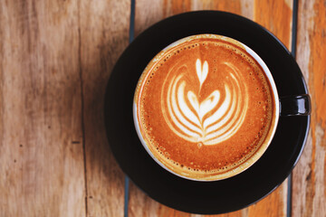 Cappuccino coffee in a beautiful mug Put on your favorite cup of coffee idea in the morning on vacation.