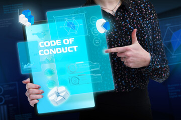 Business, Technology, Internet and network concept. Young businessman working on a virtual screen of the future and sees the inscription: Code of conduct