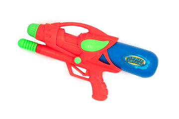 Orange toy Water Gun on white background