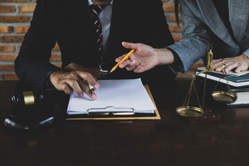 Law and Legal services concept. lawyer consulting with client discussing about lawsuit at the...