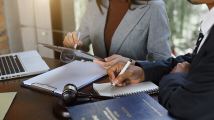 business people and lawyers discussing contract papers sitting at the table. .