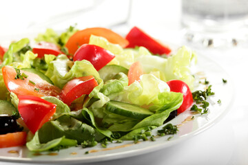 Obraz na płótnie Canvas fresh salad with tasty garnish