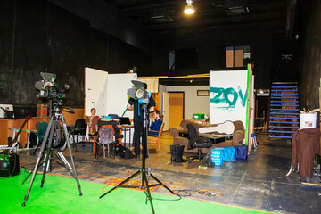 Green Screen Music and Video Production Studio with Musical Equipment and Camera Gear and Lights