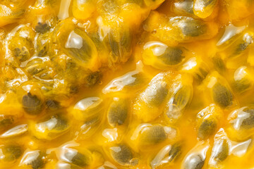 Puddle of pulp and passion fruit juice background. Top view. Macro shooting