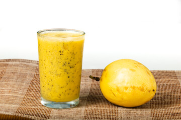 Passion fruits half and juice on white background.