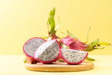 Fresh dragon fruit or pitaya on yellow background, Tropical fruit