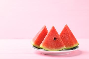 Sliced watermelon on pink color background, Tropical fruit in summer season
