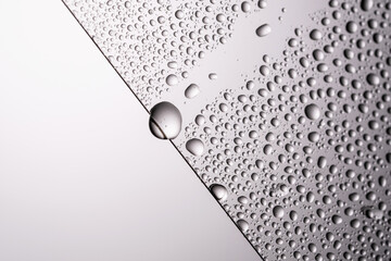 Drops of water on a transparent gray background.