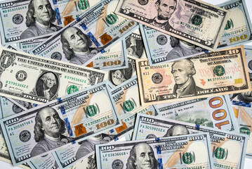 A heap of different US dollar bills. Business and financial concept. Cash money background. Flat lay