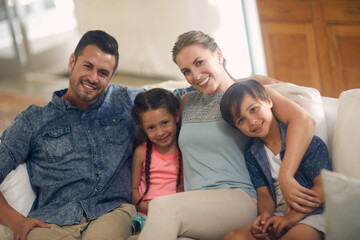 Nothing is more important that family. Shot of a family of four spending quality time together at home.