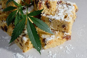 Homemade pie and powdered sugar with CBD oil. Cannabis kitchen. Marijuana cake on white textured background.
