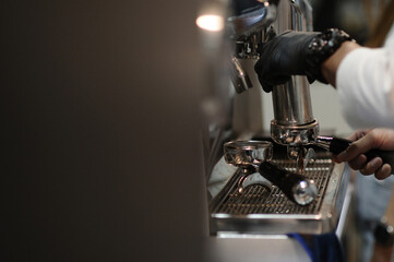 Freshly ground coffee machine. Grind coffee beans.