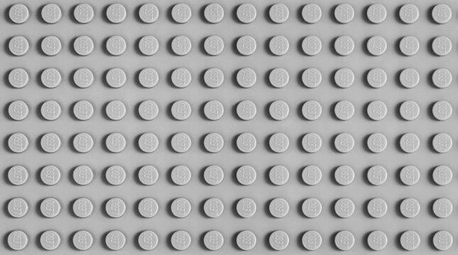 2021: base plate of Lego constructor, grey closeup texture