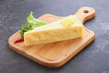 Parmesan cheese piece over board