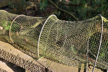 Traditional weathered fish-trap drying in the sun
