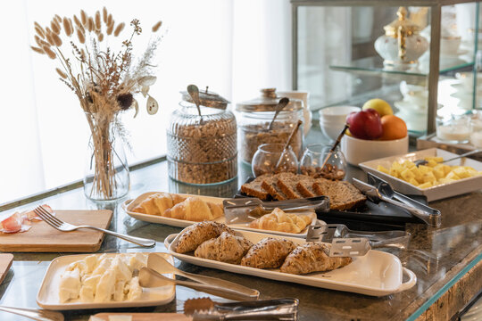 Breakfast buffet arranged on table in boutique hotel