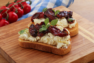 Bruschetta with soft cheese and tomato