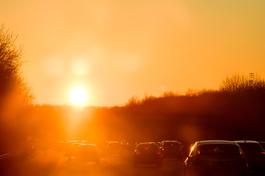 Cars Travelling On A Busy Road On Morning Commute