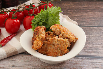 Fried salmonn cutlet in the bowl