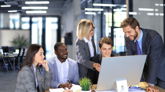 Business meeting - manager discussing work with his colleagues.