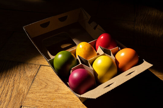 Egg carton with colorful Easter eggs