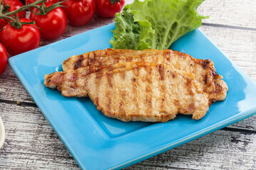 Grilled pork steak with ketchup