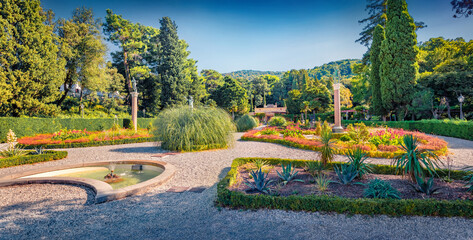 Panoramic summer view of Miramare Castle park with fountain. Fresh green scene of Italy, Europe....