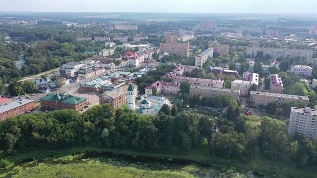 Scenic aerial view of Klin townscape with restored Orthodox Church of Resurrection on sunny summer day, Moscow Oblast, Russia. High quality 4k footage