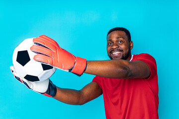 happiness brazilian player man over isolated blue background