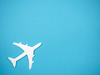 An airliner on a blue background. The concept of travel, rest and flight.