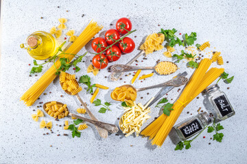 Fototapeta na wymiar Various dried spaghetti, noodles, pasta set in spoons on white table background. Different shapes types raw italian pasta with herbs, olive oil, tomatoes, spices for cooking top view copy space