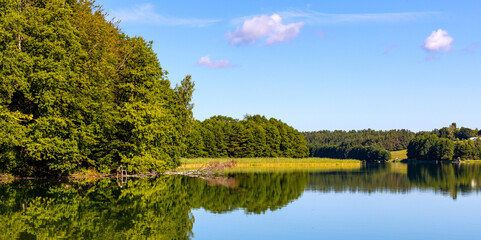 Wooded shore of Jezioro Gwiazdy lake in Bukowo Borowy Mlyn Village near Bytow of Pomerania in Kashubian region of northern Poland © Art Media Factory