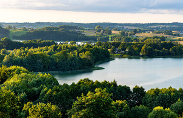 Fototapeta na wymiar Panoramic view of Jezioro Rekowo lake with shores of forest seen from Gora Tamowa Mountain in Chmielno village in Pomerania of Kashubian region of Poland