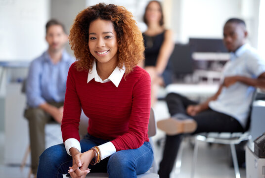 Ive Found The Right Company For Me. Portrait Of An Attractive Businesswoman With Coworkers In The Background.