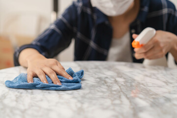 Cleaning hygiene, close up hand of young maid woman wearing protective gloves while cleaning on...