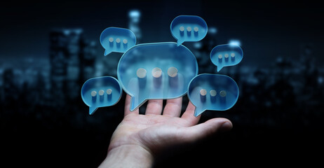 Businessman in dark using digital speech bubbles talk icons. Minimal conversation or social media...
