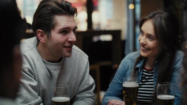 Mid shot video of group of friends spending time in the pub. Shot with RED helium camera in 8K. 