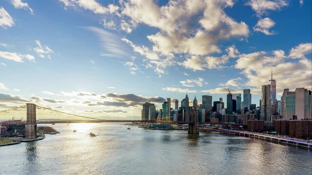 Panoramic view of Brooklyn bridge and Manhattan. Timelapse at sunset, New York City.