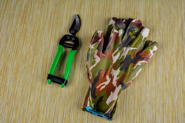 Garden gloves with a pruner for working in the garden .