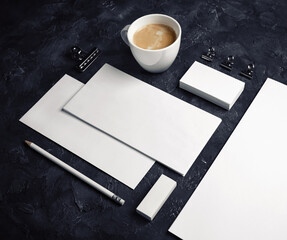 Branding mock up. Photo of blank corporate stationery set on black plaster background.
