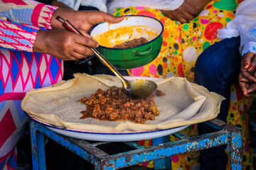 Traditional Food - Stewed Meat with Injeira in Asmara, Eritrea - obrazy, fototapety, plakaty