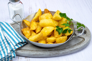 close up of baked potato in dish